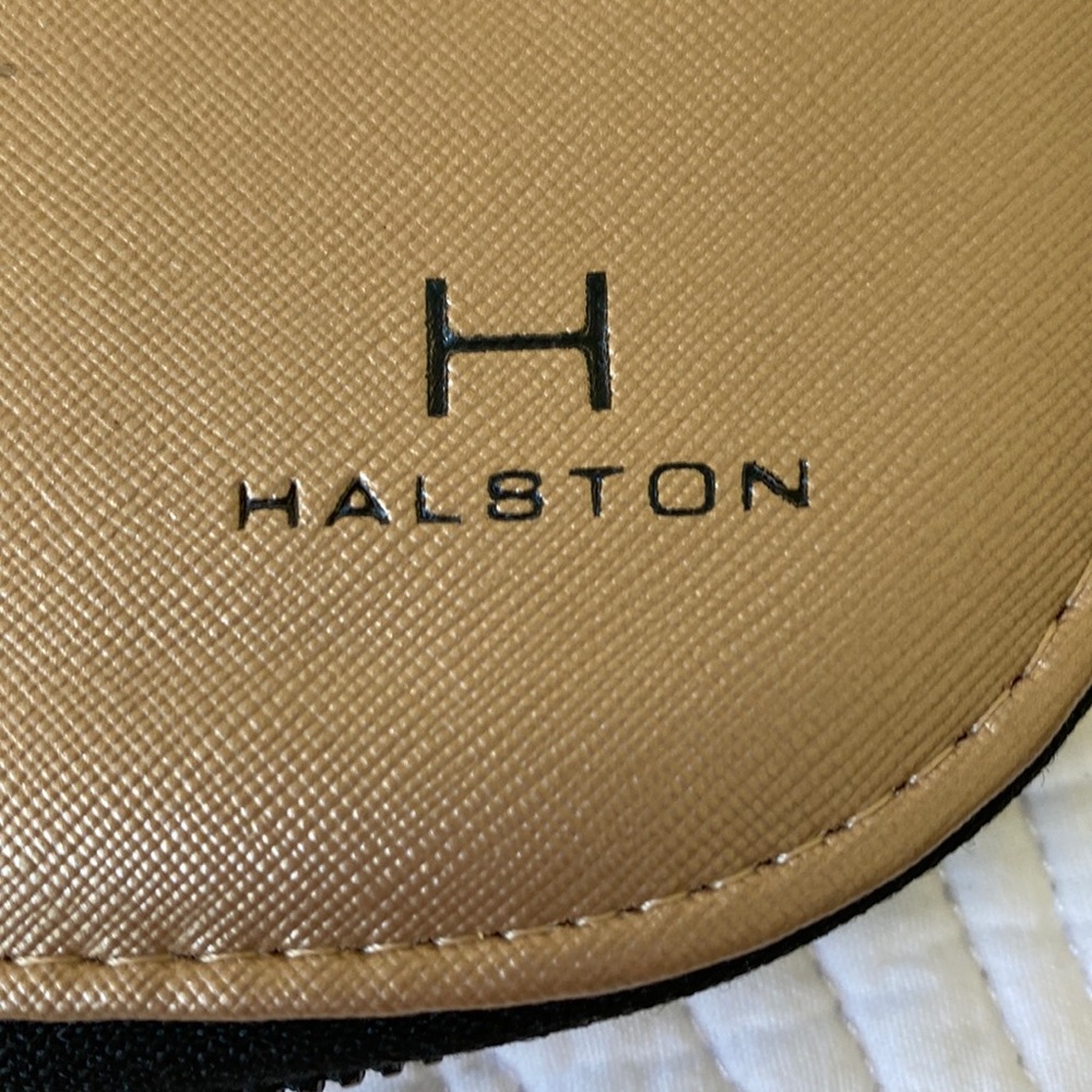 Halston travel jewelry case. Gold vinyl with black flocked interior.